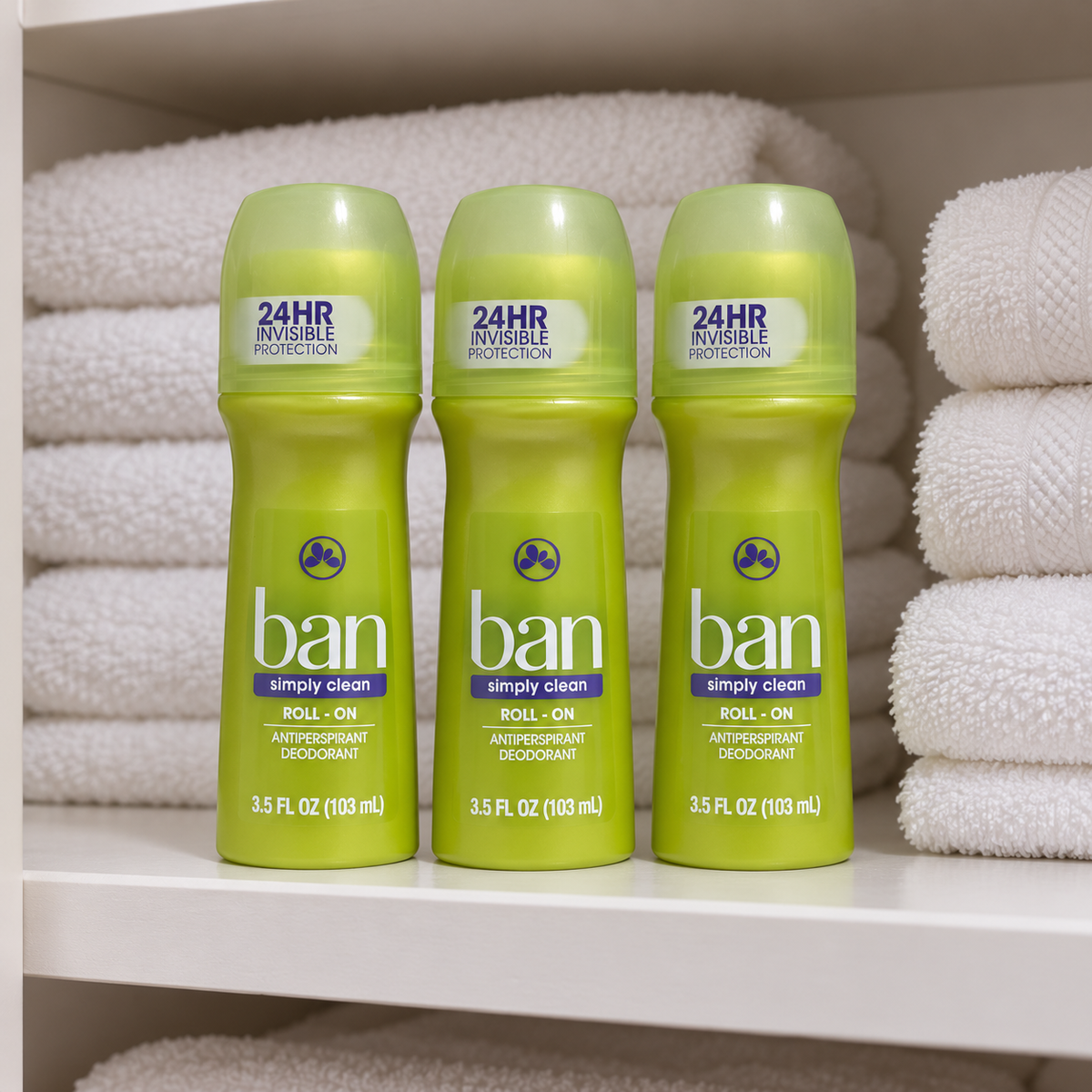 AI-generated lifestyle scene of three capped Ban Simply Clean 3.5 fl oz roll-on bottles on a linen shelf; props not included