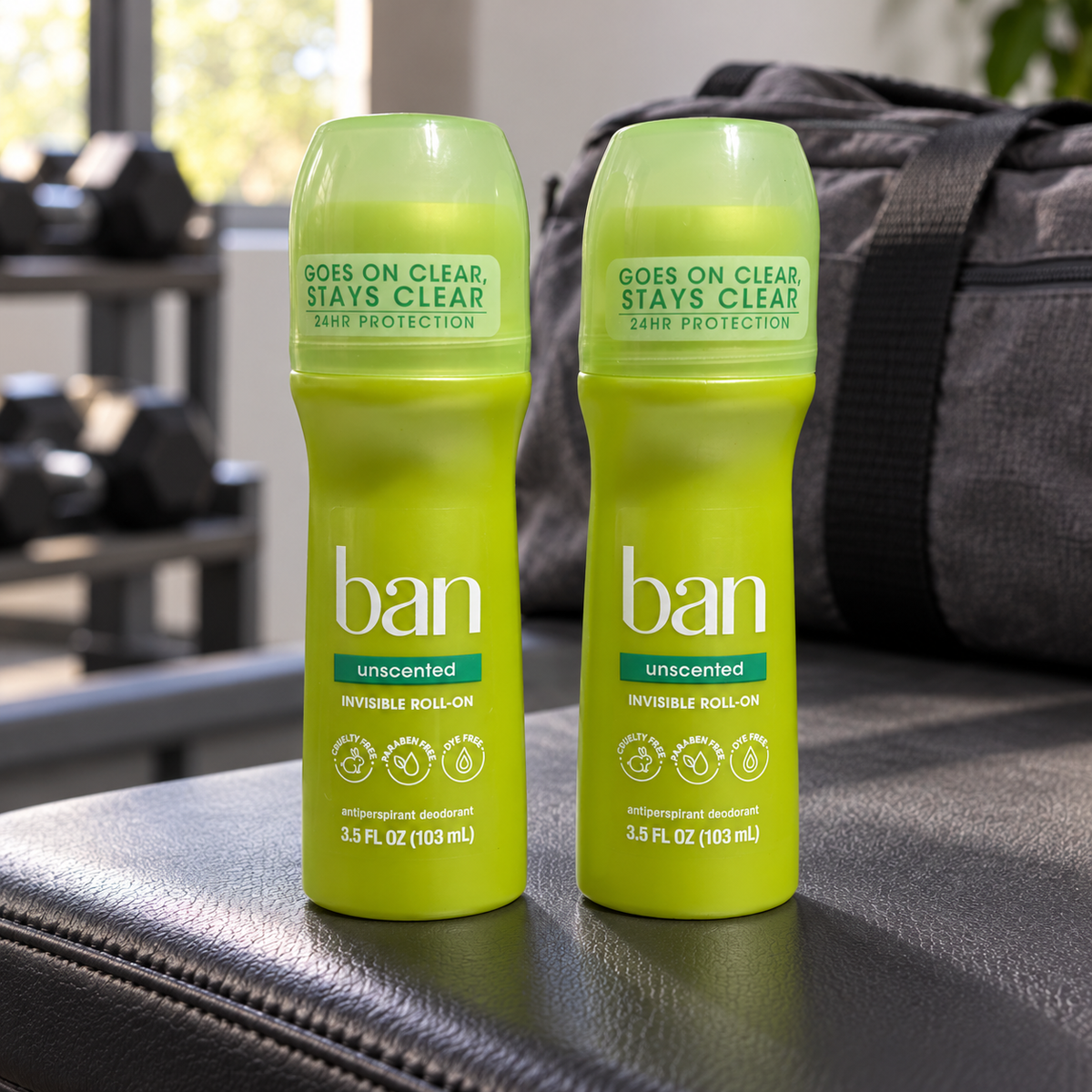 AI-generated lifestyle scene of two capped Ban Unscented Invisible Roll-On 3.5 fl oz bottles on a home gym bench; props not included