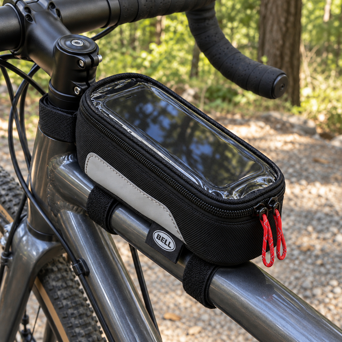 Bell Top Tube Phone Bag mounted on a bicycle at a wooded trail; lifestyle illustration, phone and bicycle not included