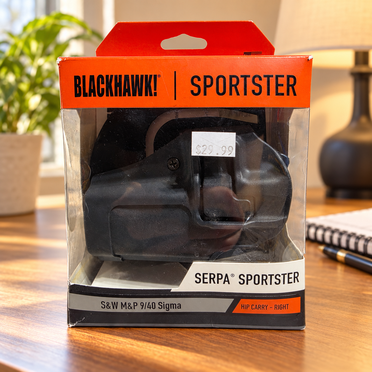 AI-generated home-desk scene of the boxed Blackhawk SERPA Sportster right-hand holster; desk props not included.