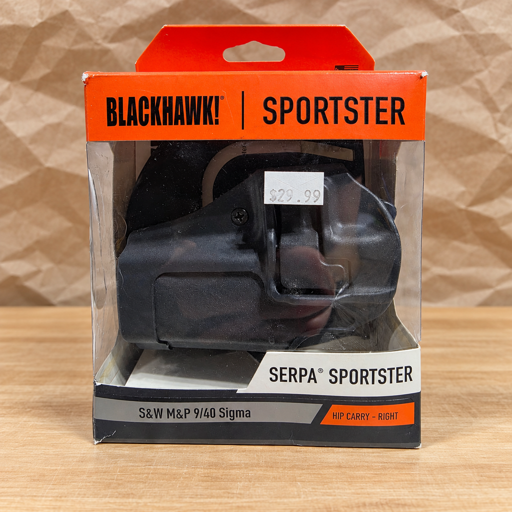 AI-generated packing-table scene of the boxed Blackhawk SERPA Sportster holster; packing props not included.
