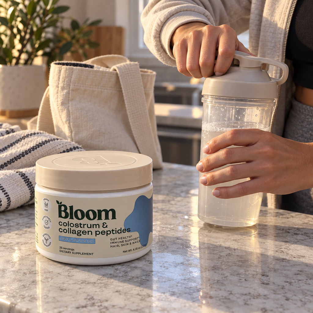 Hands closing a shaker bottle beside Bloom unflavored colostrum and collagen powder