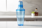 AI-generated lifestyle illustration of the blue cocktail shaker: counter; drinks and background props not included.