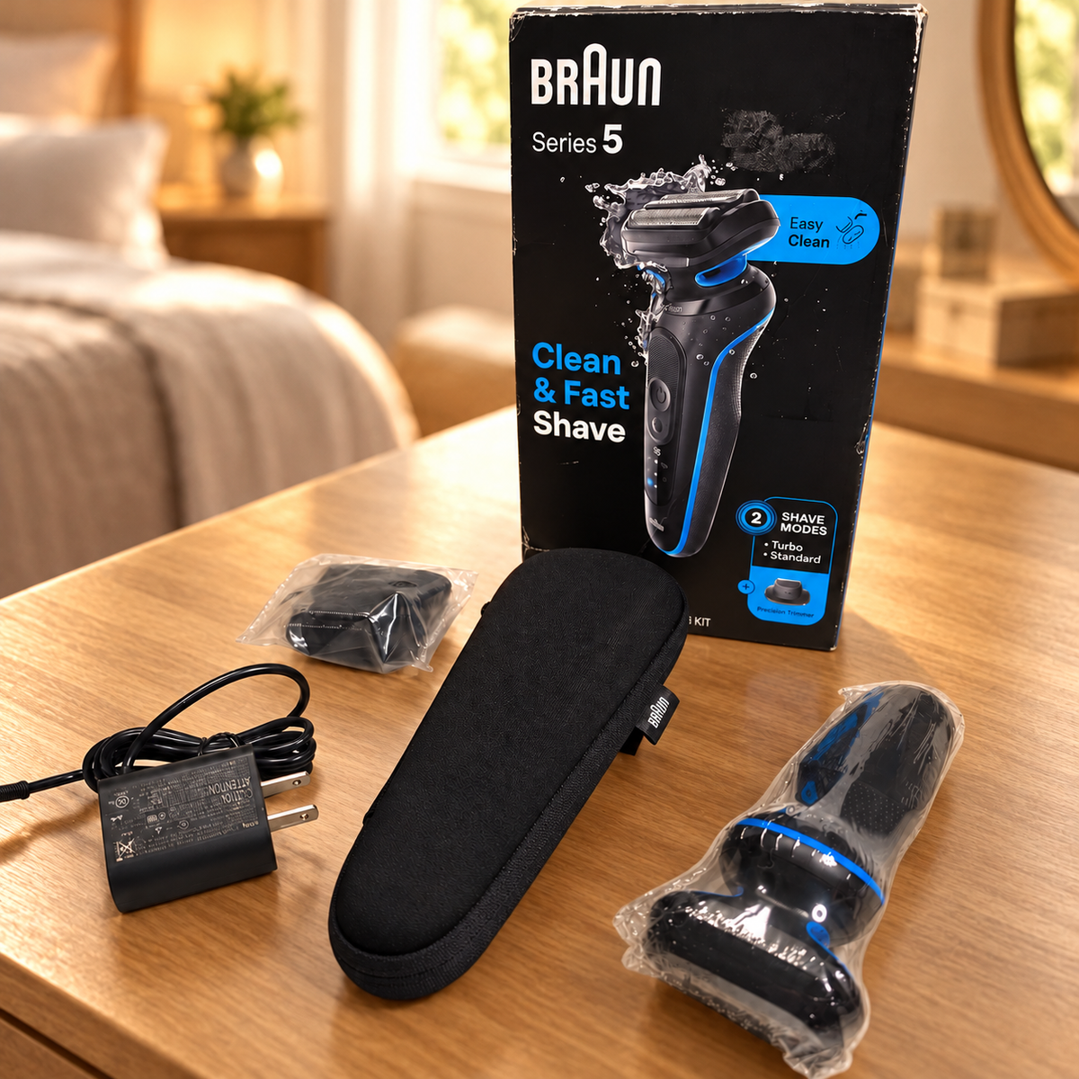Braun 5118s boxed kit on warm wood dressing table; illustrative background