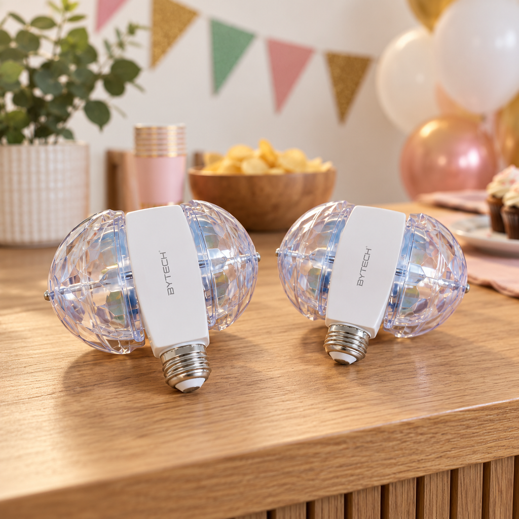 AI-generated lifestyle illustration of two unlit Bytech disco bulbs on a party-preparation table; decorative props not included.