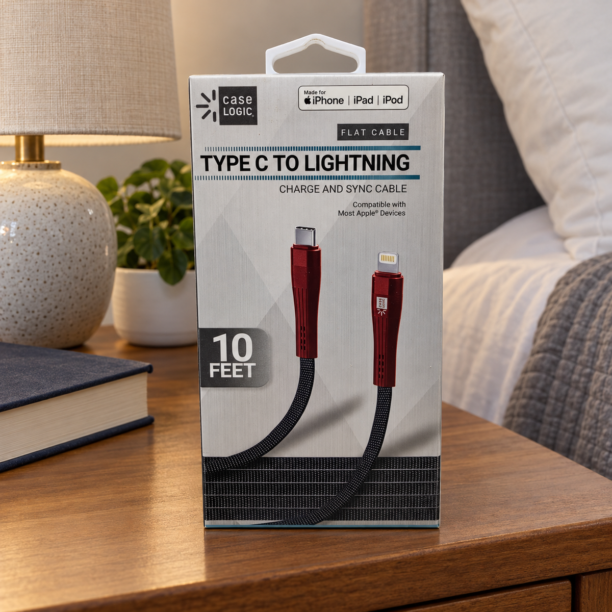 AI-generated scene: Case Logic 10ft flat Type C to Lightning cable carton on bedroom nightstand; lamp and book excluded