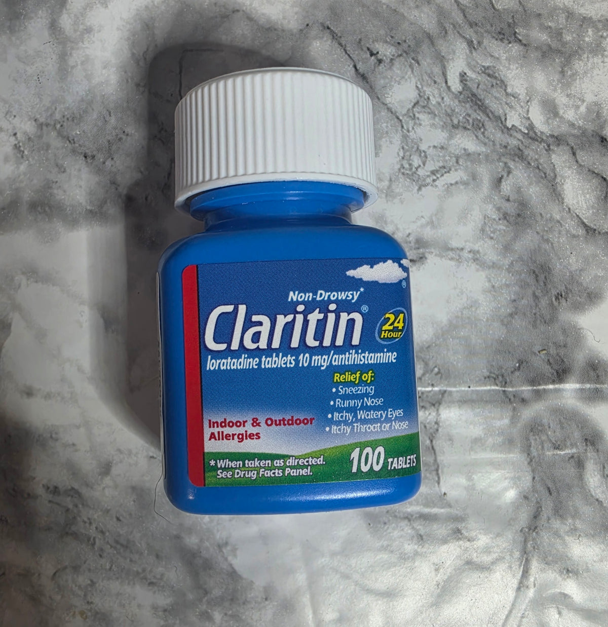 Actual Claritin loratadine10mg100-tablet bottle front, no retail box, with label wear.