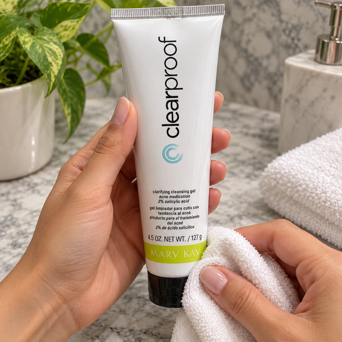 Wiping the outside of a closed Clear Proof cleansing gel tube with a dry cloth