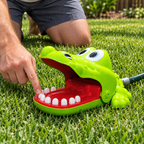 Pressing a tooth during a game of Crocodile Dentist Splash on the lawn
