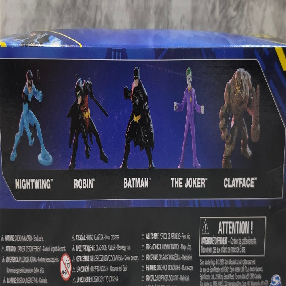 Actual stocked product photo detail of DC 5-figure pack back panel character lineup and origin information.