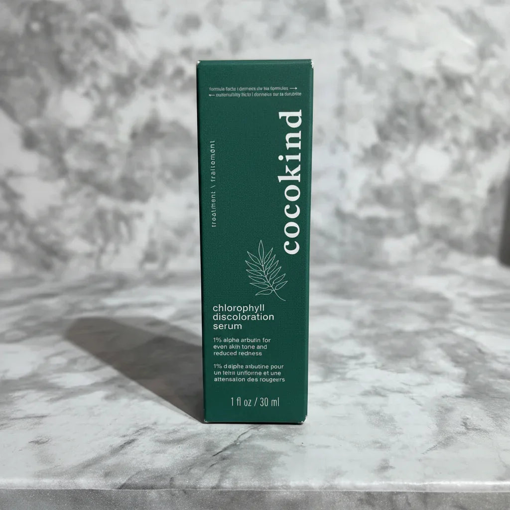 Deep green serum box on marble