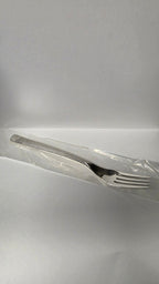 Actual Guy Degrenne Guest Star dessert fork with textured handle in its protective sleeve