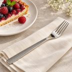 Guest Star dessert fork beside a dessert place setting