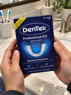 DenTek Professional-Fit Dental Guard carton held beside a bathroom sink