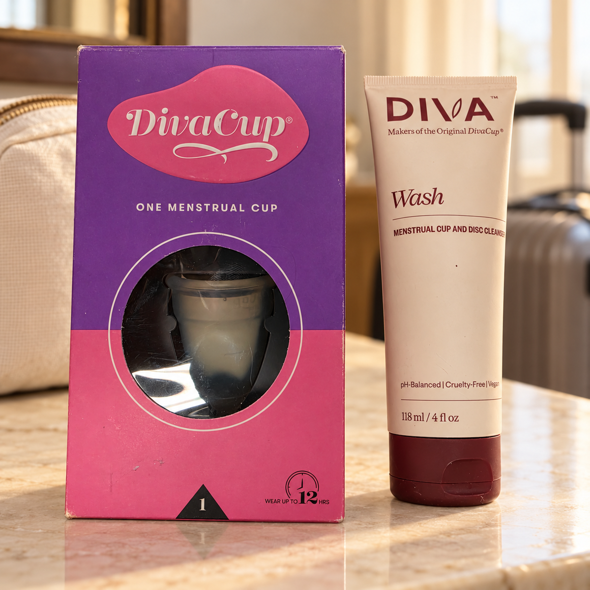 DivaCup Model 1 and DIVA Wash 118 mL in a travel setting; lifestyle illustration, props not included