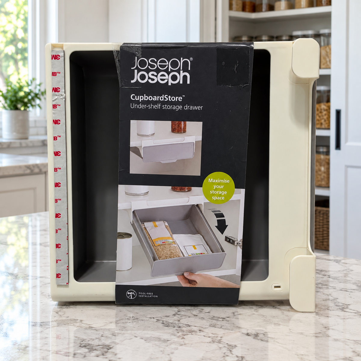 CupboardStore drawer with information sleeve on a kitchen counter; some units lack the sticker