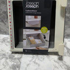 Joseph Joseph CupboardStore grey under-shelf storage drawer with information sticker; some units lack the sticker
