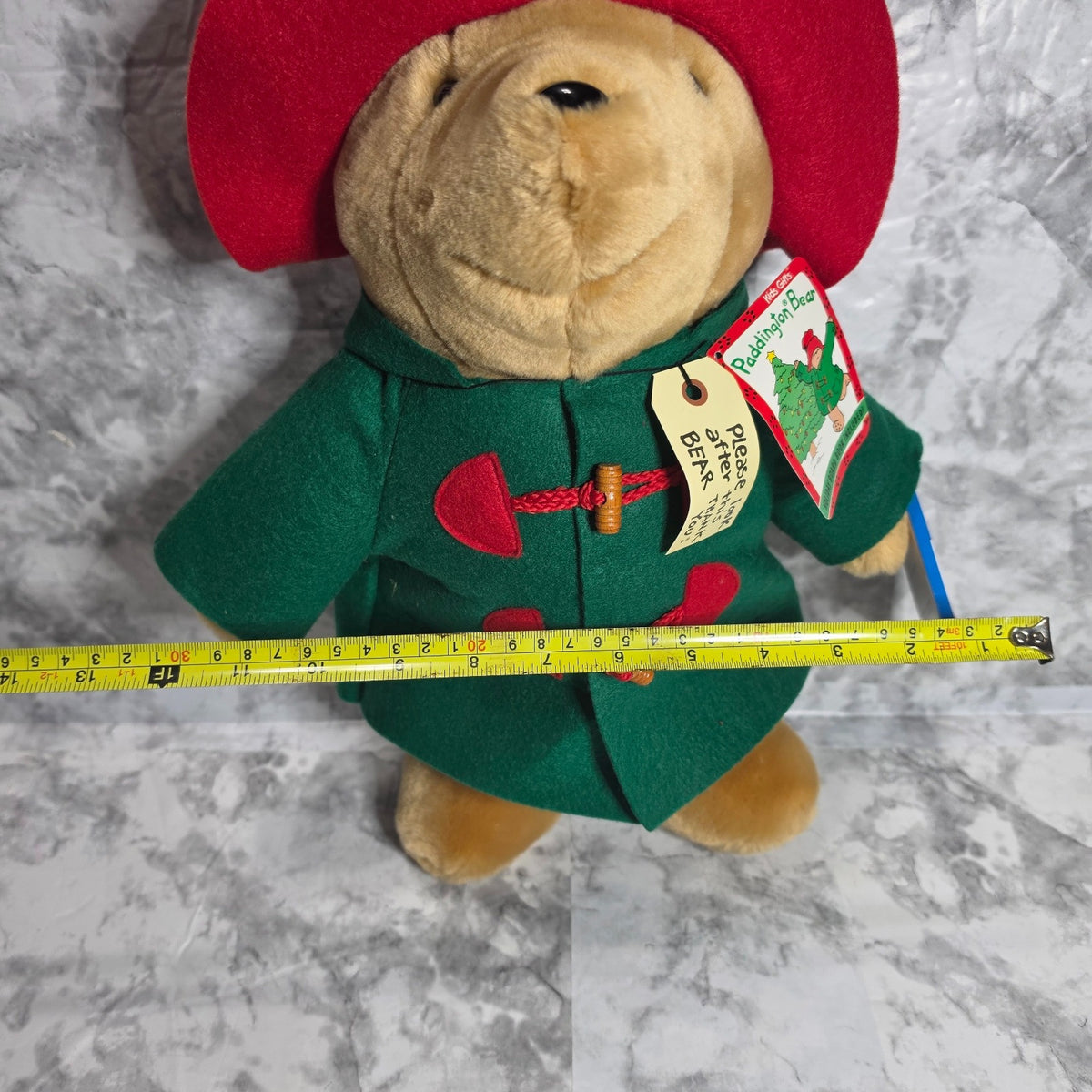 Actual holiday Paddington bear photographed with width measuring tape