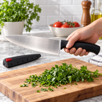 Adult holding Farberware chef knife by its black ergonomic handle above a chopping board