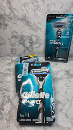 Gillette Mach3 retail packages showing creases and wear on a marble-pattern surface
