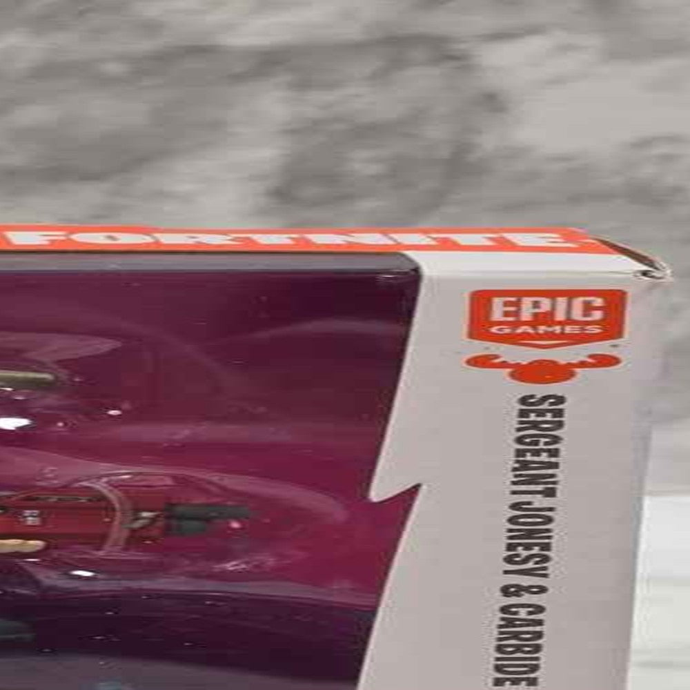 Actual stocked product photo detail of Fortnite Sergeant Jonesy and Carbide 2-pack age and brand markings.