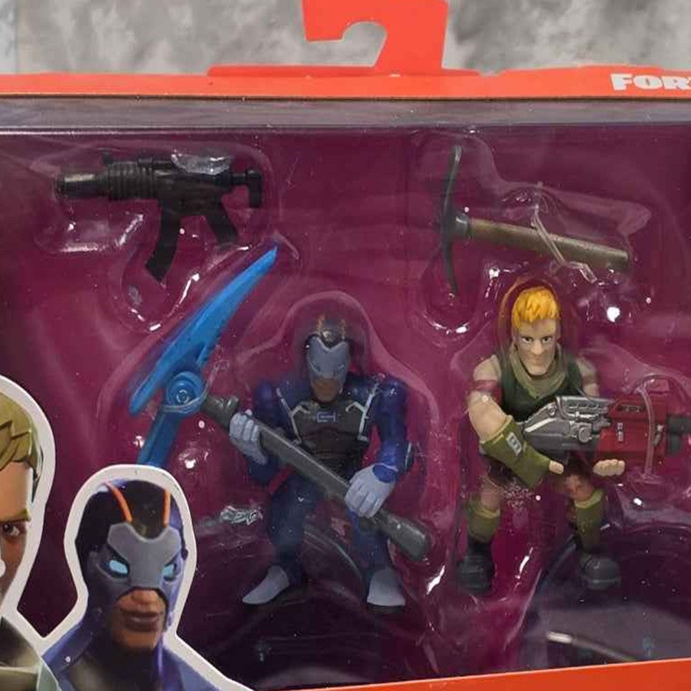 Actual stocked product photo detail of Fortnite Sergeant Jonesy and Carbide figures with accessories.