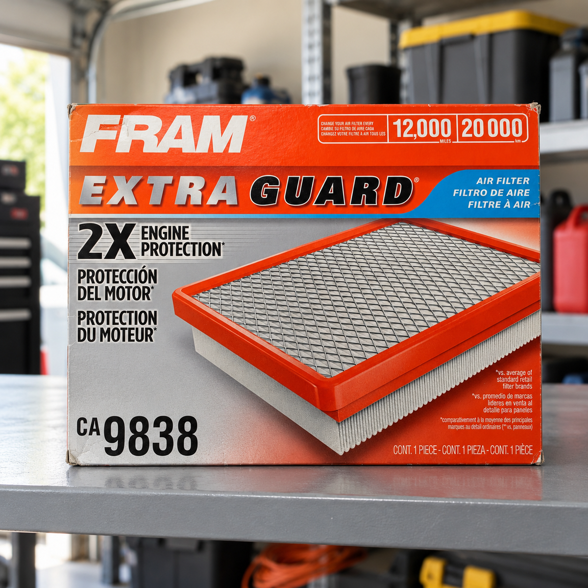FRAM CA9838 Extra Guard box on a garage utility shelf lifestyle scene; AI-staged composite.
