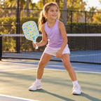 AI-generated scene of a child in a ready stance holding the Franklin fruit pickleball paddle.