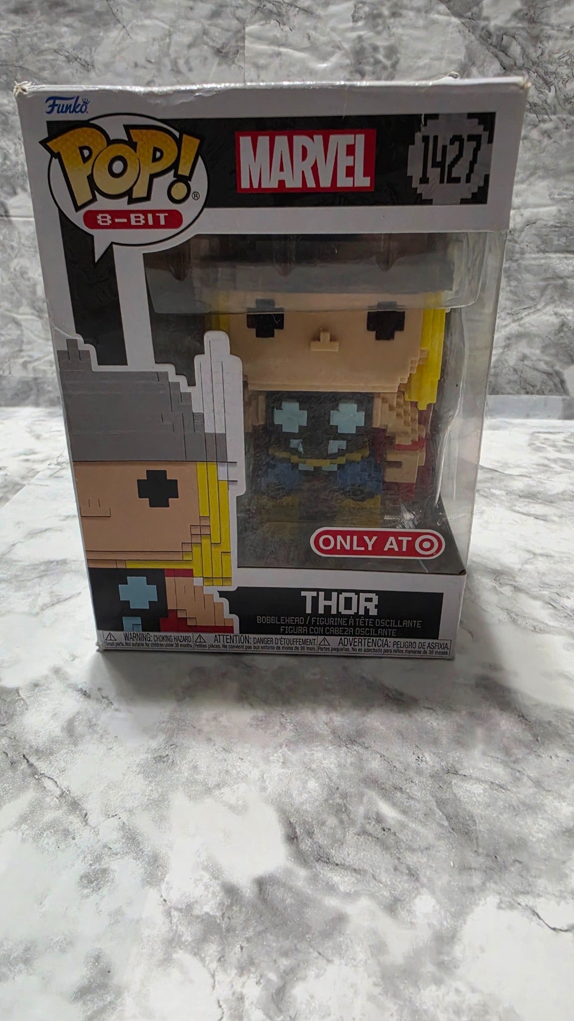 Actual front inventory photo: Funko Pop! 8-Bit Thor #1427 Target Exclusive in its worn original box; rear-panel tear is described in the listing