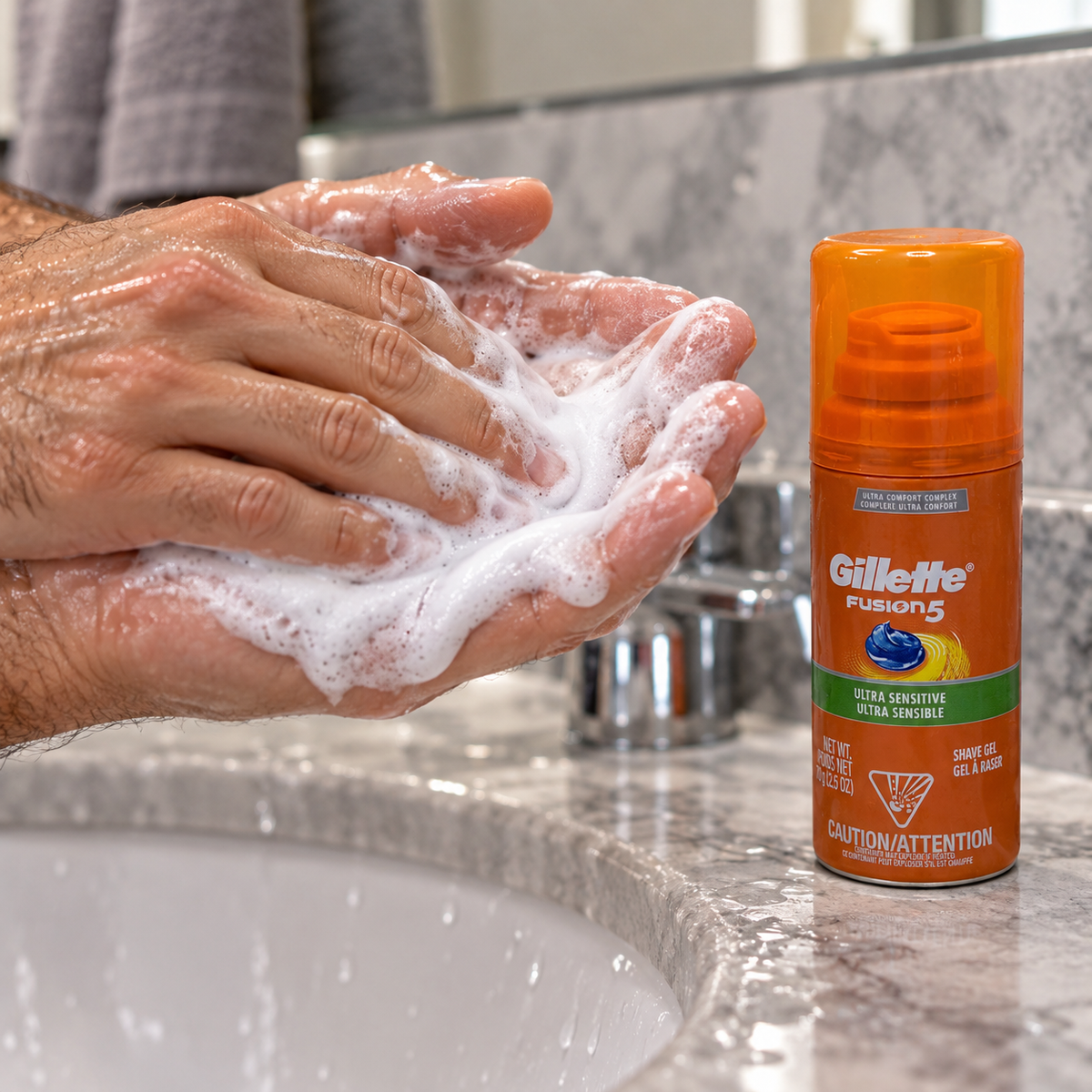 Working shave gel into lather with the 2.5 oz Fusion5 can on the counter