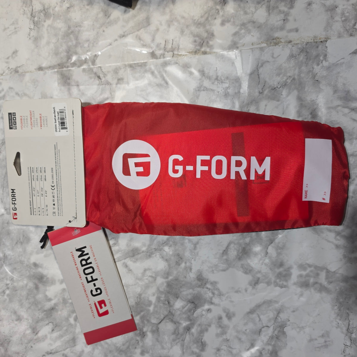 G-Form Pro-S Compact Shin Guards XL black red carry sleeve with back packaging and sizing chart