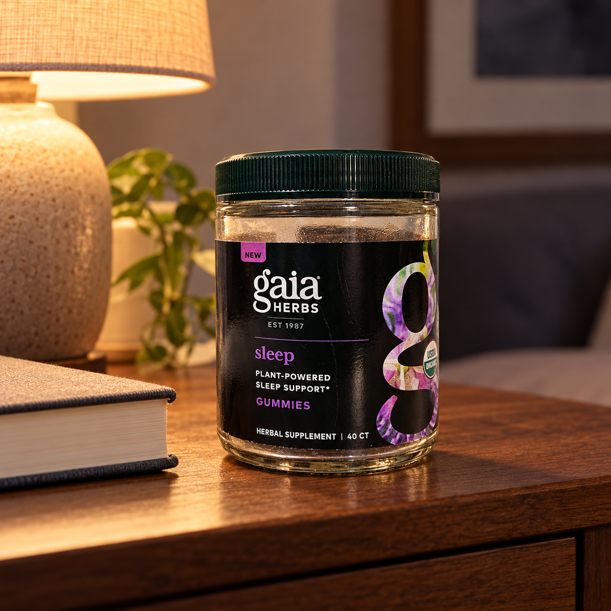 AI-generated illustrative scene of the closed Gaia Herbs Organic Sleep Gummies, 40 Count package on a bedside table with a book.