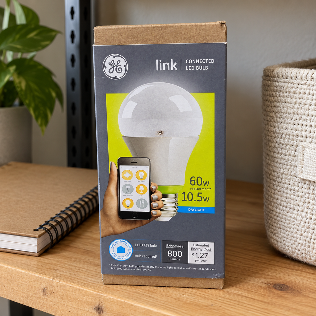 GE Link A19 daylight LED bulb carton in household shelf setting; AI-generated lifestyle illustration