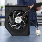 GE WR60X23363 condenser fan assembly on a technician preparation bench; illustrative setting, not an installed-product view