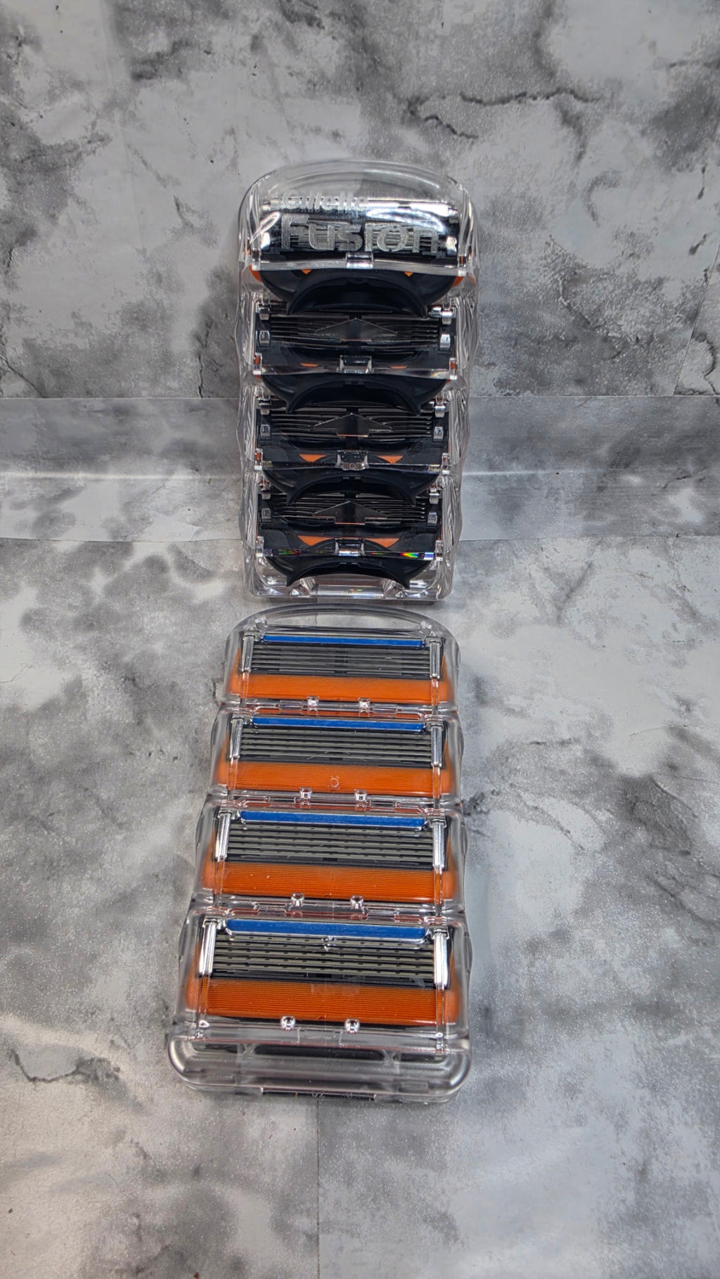 Gillette Fusion5 unboxed four-cartridge trays shown front and back; each option contains one tray