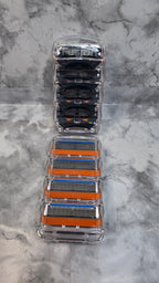 Gillette Fusion5 unboxed four-cartridge trays shown front and back; each option contains one tray
