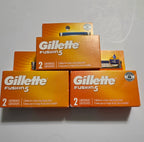 Three Gillette Fusion5 two-count boxes, six cartridges total, with carton edge wear