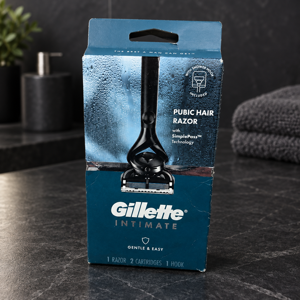 Gillette Intimate razor kit in its original blue box on a dark stone bathroom counter