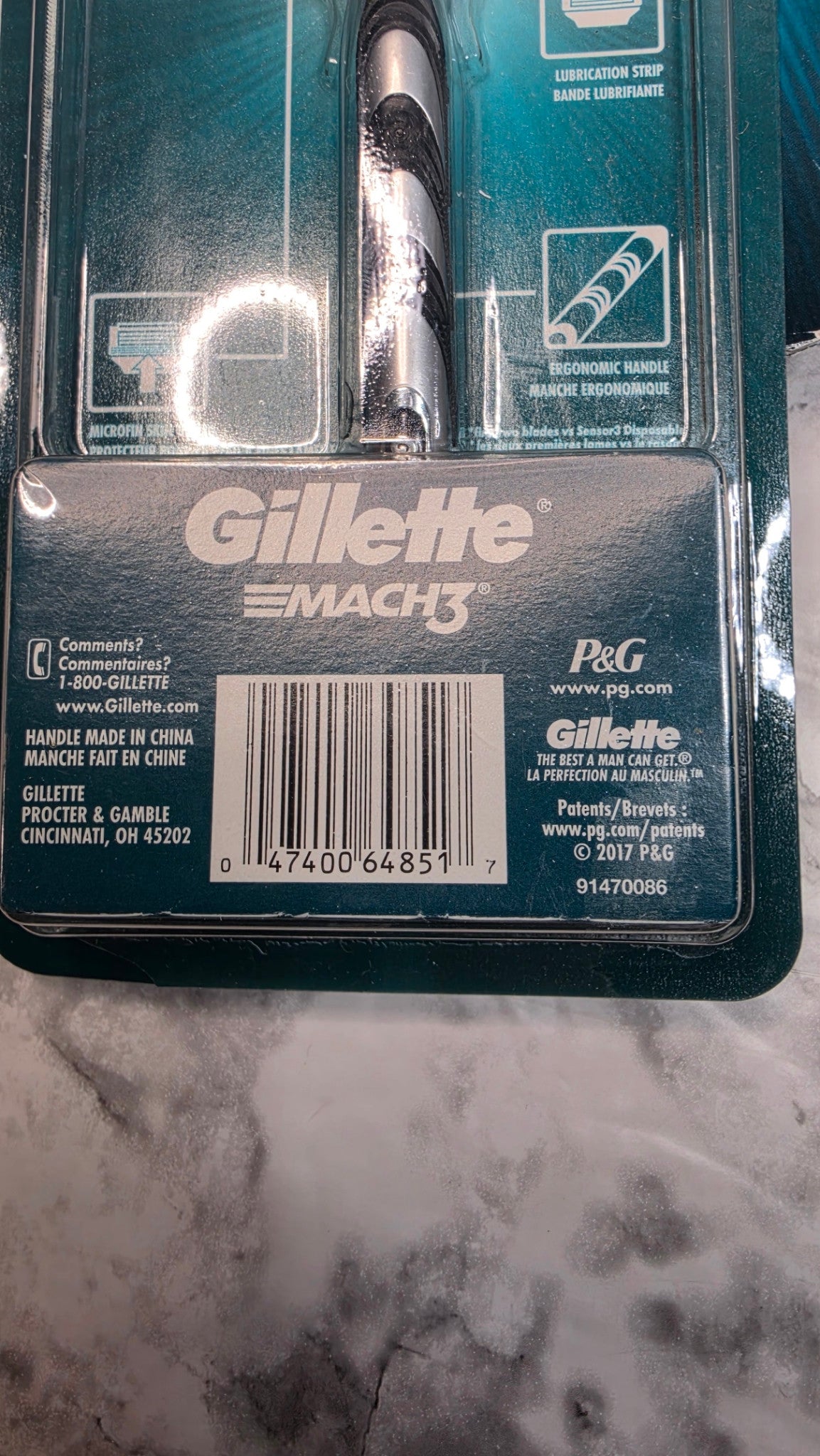 Back detail of one Gillette MACH3 Original pack in the three-pack bundle, showing handle, package labeling and single-pack barcode