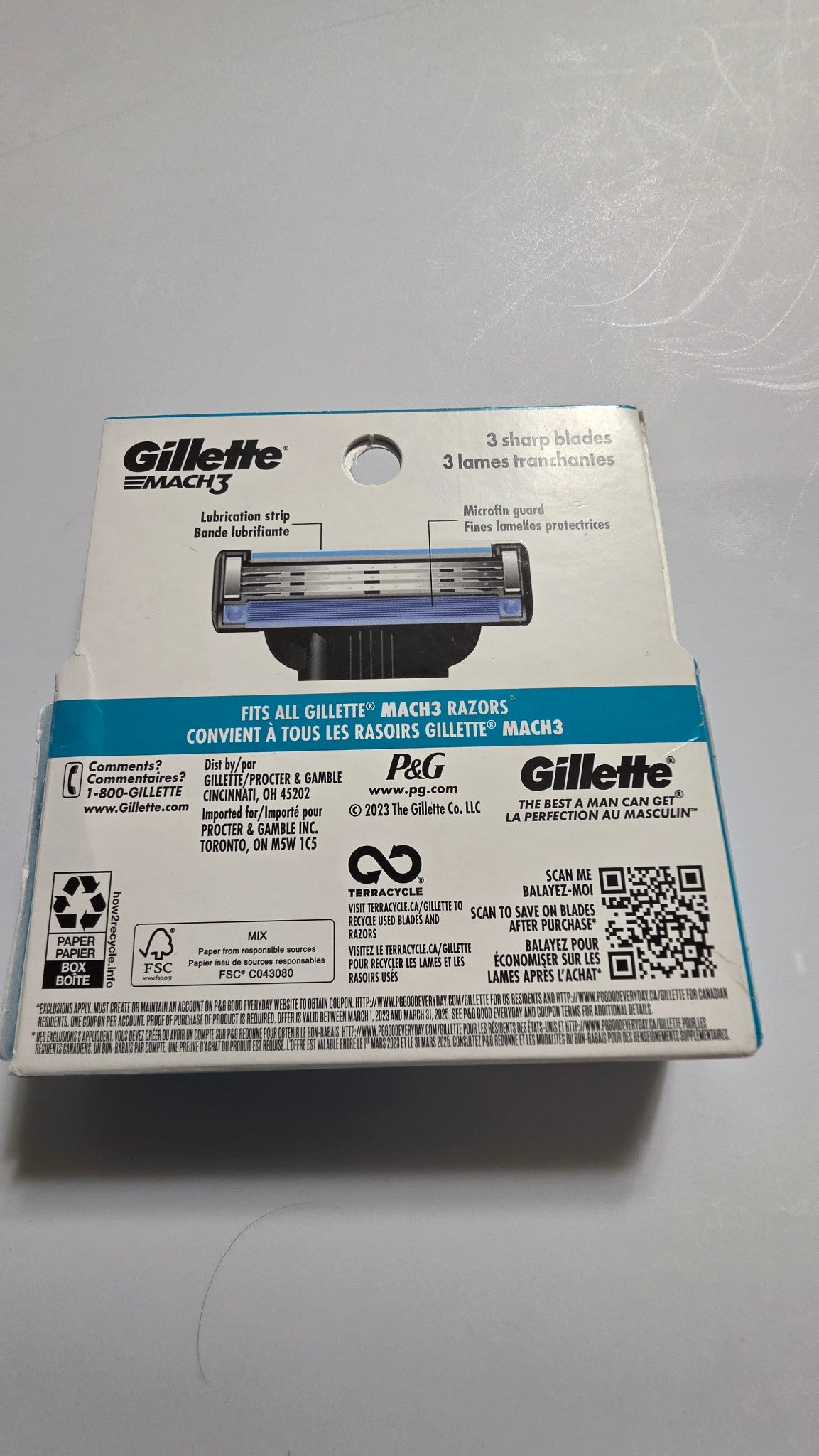Actual back of Gillette MACH3 Original refill package showing three blades, lubrication strip, microfin guard and MACH3 compatibility