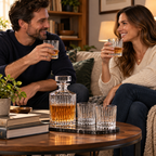 Two adults enjoying drinks with a Godinger Ludlow decanter and four matching glasses