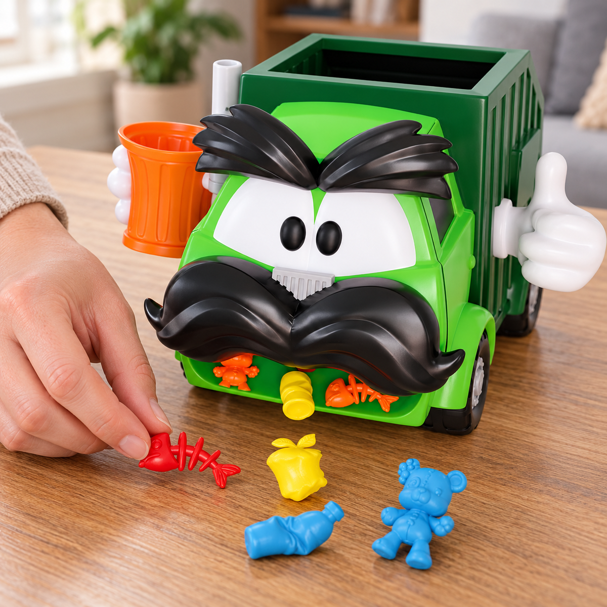 Goliath Trash Stash truck with colorful trash pieces being gathered for play.