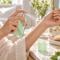 Applying Elizabeth Arden Green Tea Scent Spray to a wrist