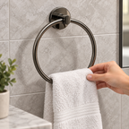 Placing a hand towel on a Hard Graphite GROHE Essentials towel ring