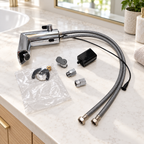 GROHE chrome touchless faucet with battery, housing, hoses and fittings laid out on a bright bathroom quartz counter; illustrative setting, props not included