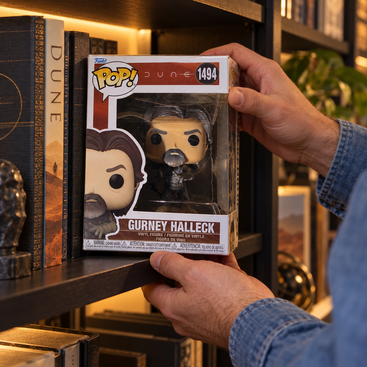 Boxed Funko Pop! Gurney Halleck #1494 being placed on a bookshelf.