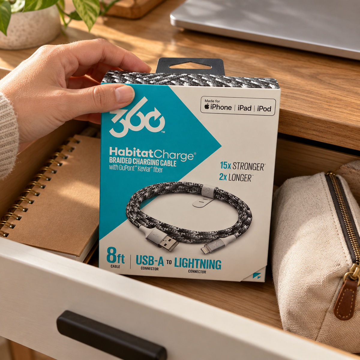 AI-generated lifestyle illustration of a boxed Steel HabitatCharge 8-foot cable in a drawer; devices and background props not included.
