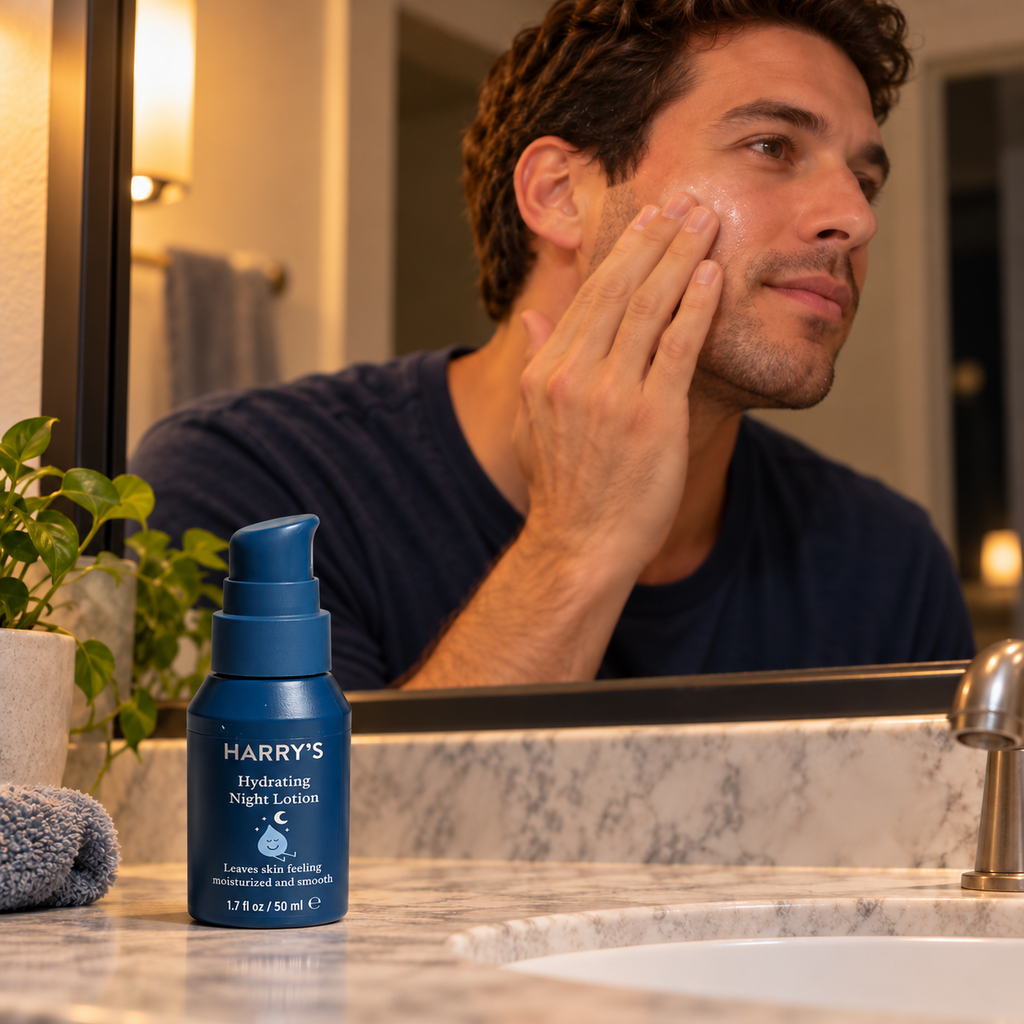 Harry's Hydrating Night Lotion beside an adult applying facial lotion during an evening routine