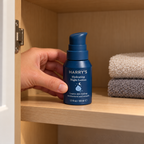 Harry's Hydrating Night Lotion placed on a bathroom cabinet shelf