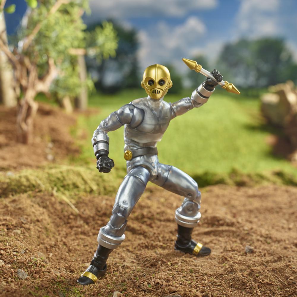 Zeo Cog figure with the closed head raising the short staff in an articulated action pose